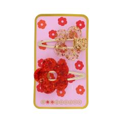 Lot de 2 barrettes fleurs à paillettes rouge et doré
